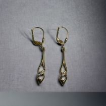 A pair of 9ct Gold ladies drop earrings. Stamped 375.  Length - 40mm