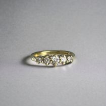 A 9ct Gold Diamond ring. Set with five diamonds, totalling 25pts. Full hallmarks. Size - H/I.