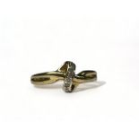 A 9ct gold & diamond cross over ring. Size - k 1/2. Approx. 1.3g 