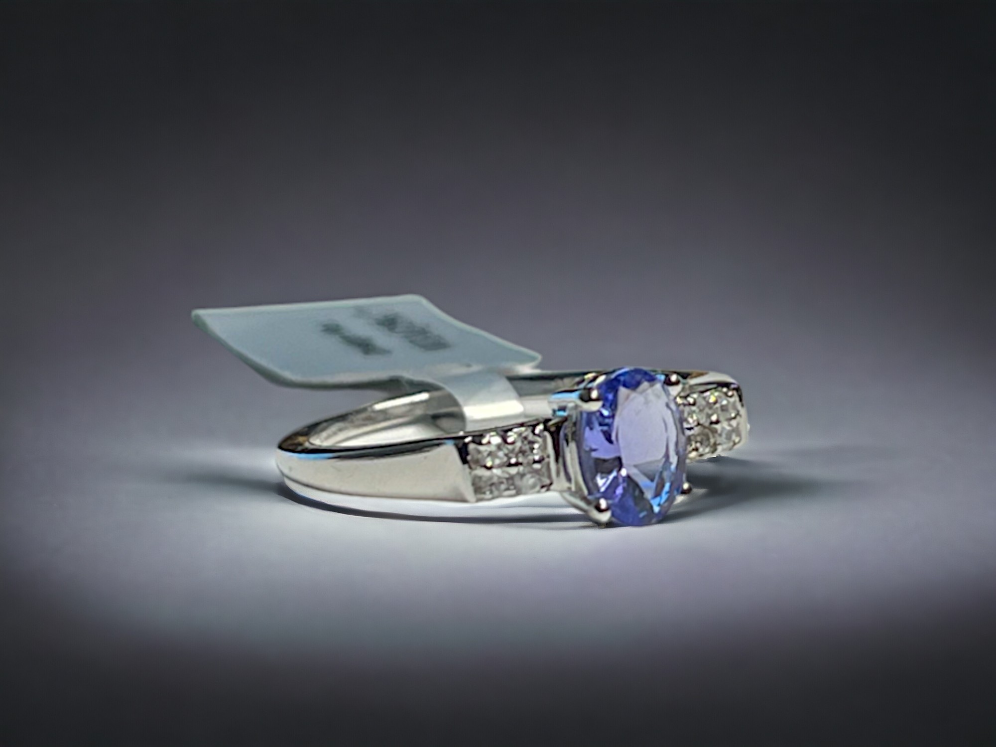 A 9CT white gold & Tanzanite ladies ring.  Set with an oval cut solitaire 0.75ct Tanzanite accented  - Image 2 of 3