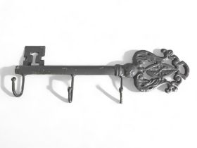 A cast iron painted 'Key' shape key holder.