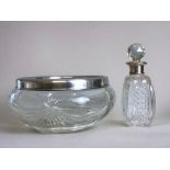 A sterling silver rimed cut glass fruit bowl, together with silver collar scene bottle. Full hallmar