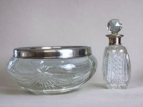 A sterling silver rimed cut glass fruit bowl, together with silver collar scene bottle. Full hallmar