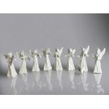 A collection of eight Dresden porcelain angels. 