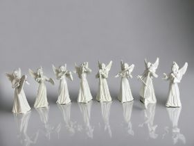 A collection of eight Dresden porcelain angels.