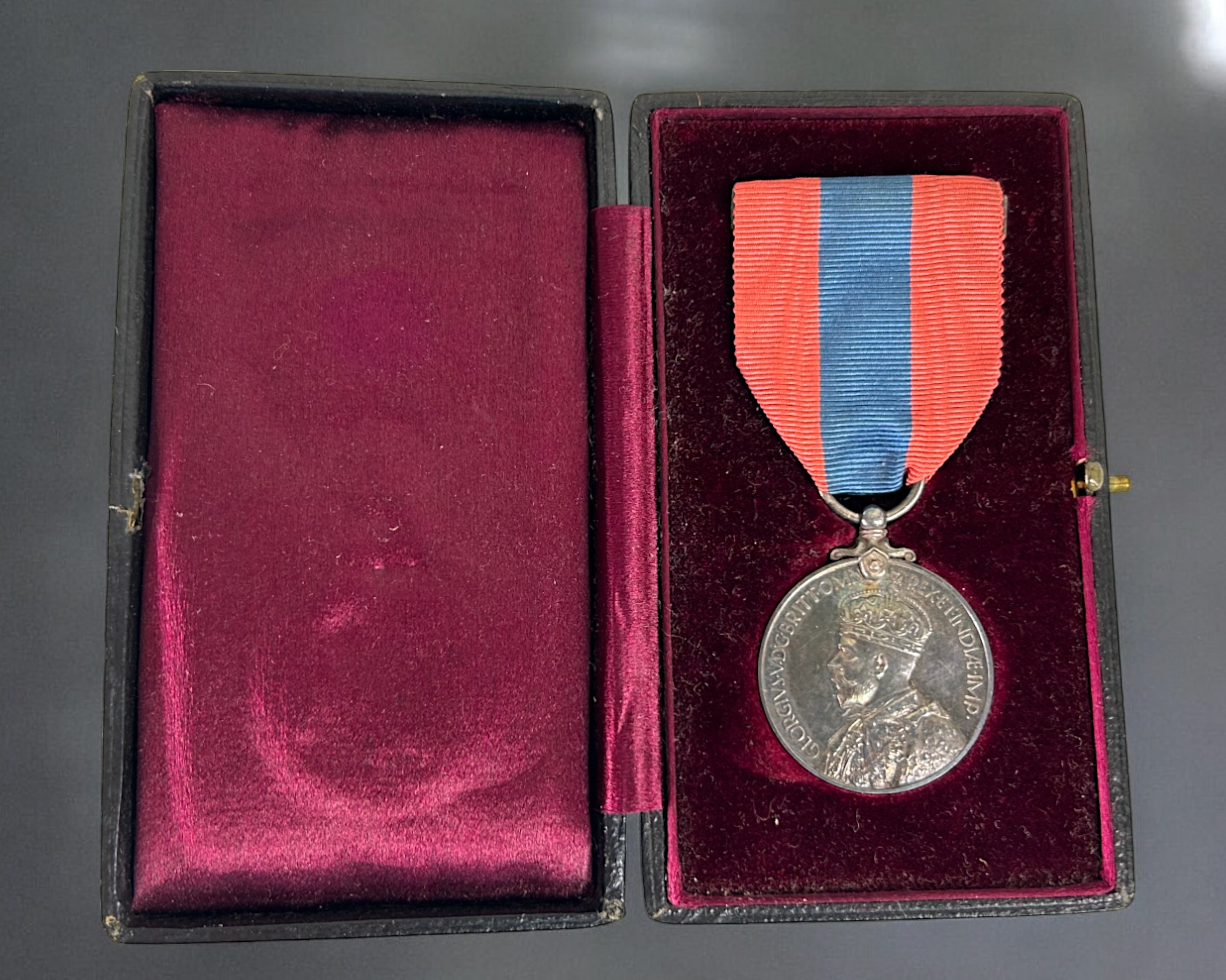 A boxed Imperial service medal, George V. Awarded to Alfred Vodden Edwards. With ribbon & case.