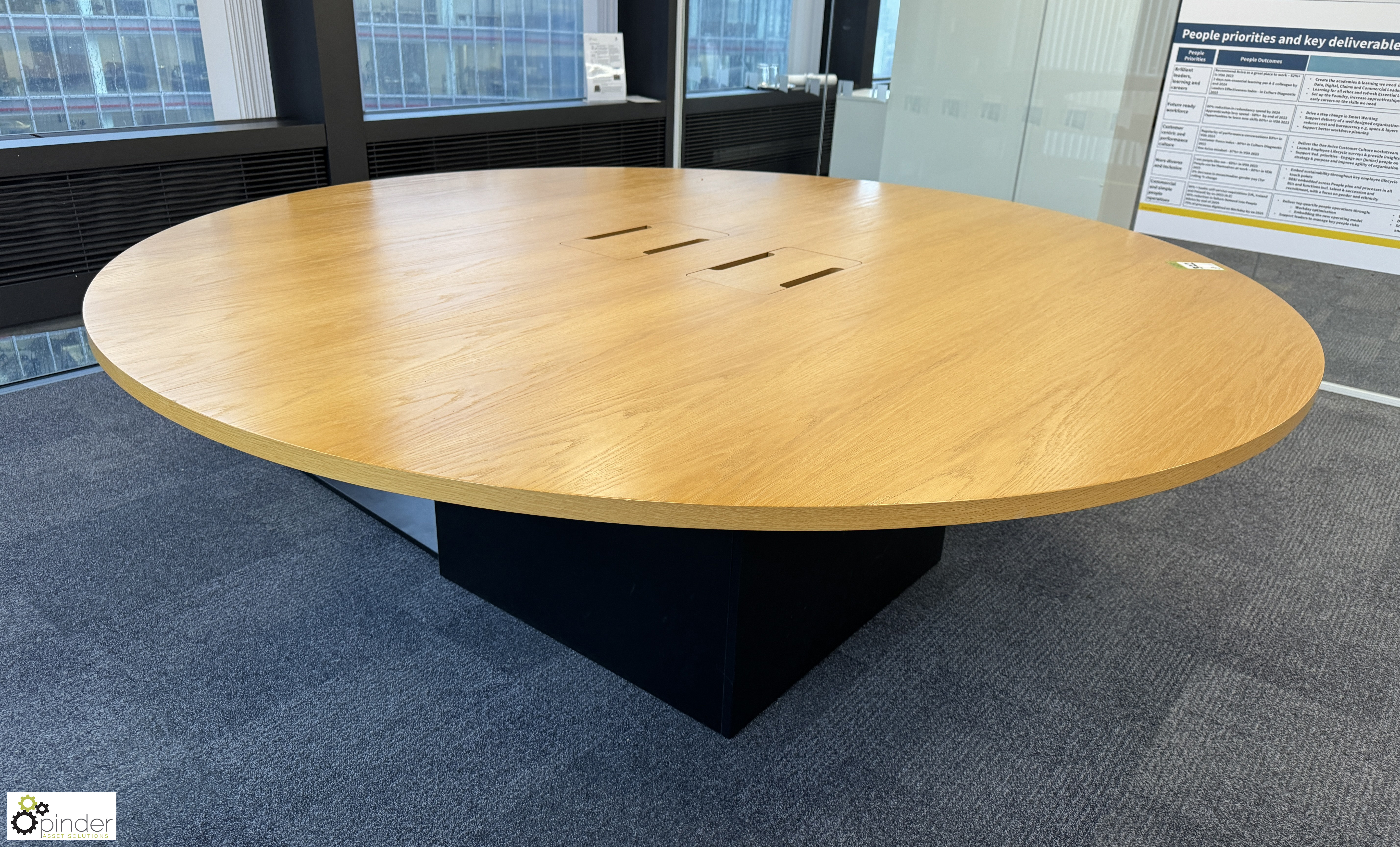 Light oak veneer circular Meeting Table, 2200mm x 750mm, with cable management and base (location in - Image 4 of 7