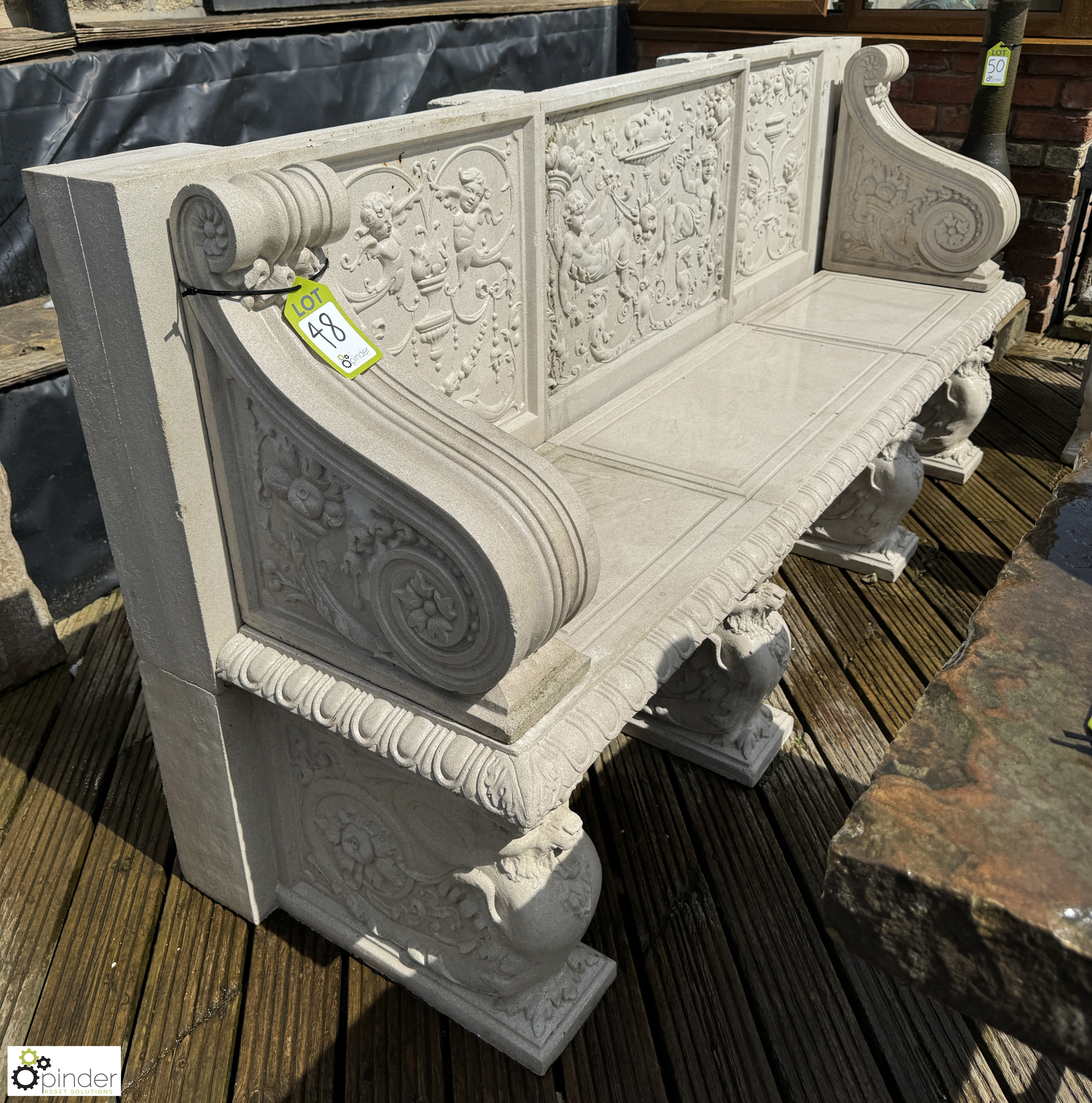 A reconstituted Haddonstone Garden Bench, with classical decoration by Raphael, approx. 40in x 86in