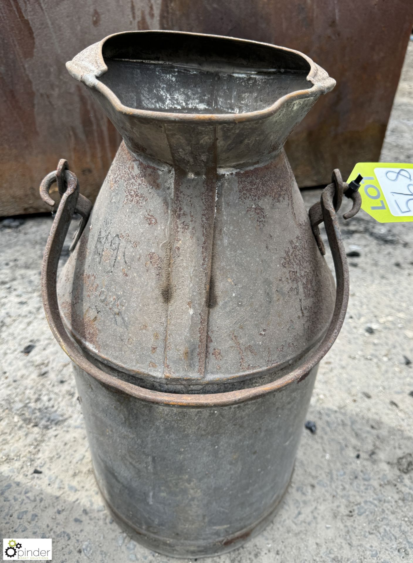 A galvanised metal Milk Churn, stamped 5 gallons,