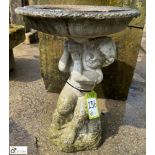 A reconstituted stone Statue, depicting cherub holding a bowl, approx. 22in x 16in diameter