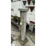 A reconstituted stone octagonal Sundial Plinth, with round sundial plate with Roman numerals,