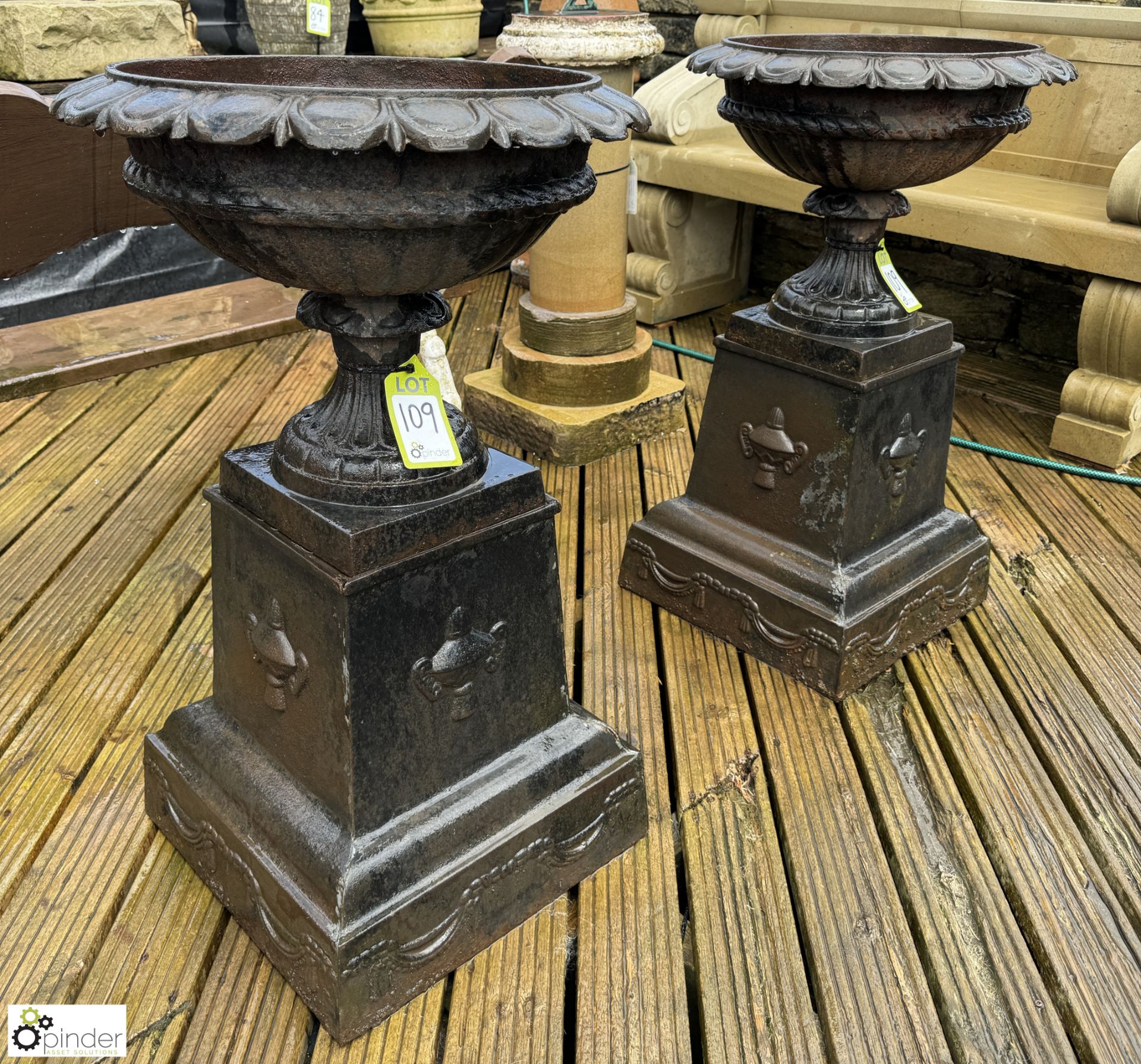 A pair cast iron Garden Urns, with egg and dart decoration on cast iron plinths, with fruit and swag - Image 3 of 10