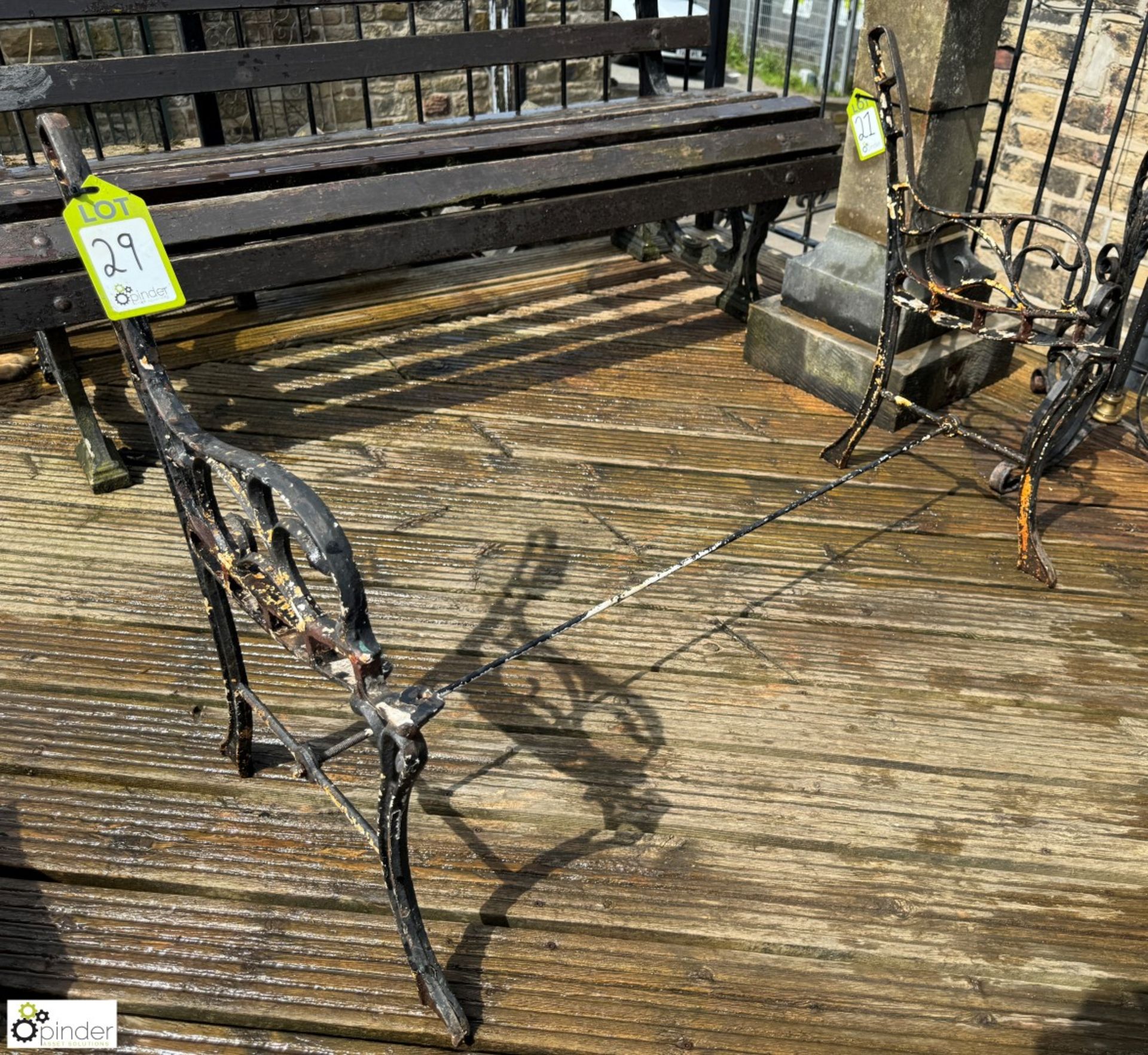 A pair cast iron decorative Garden Bench Ends, with original stretcher, approx. 28in x 42in, circa