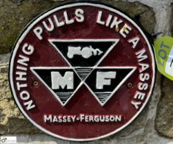 A round cast iron Massey Ferguson Sign “Nothing pulls like a Massey”, approx. 9in diameter