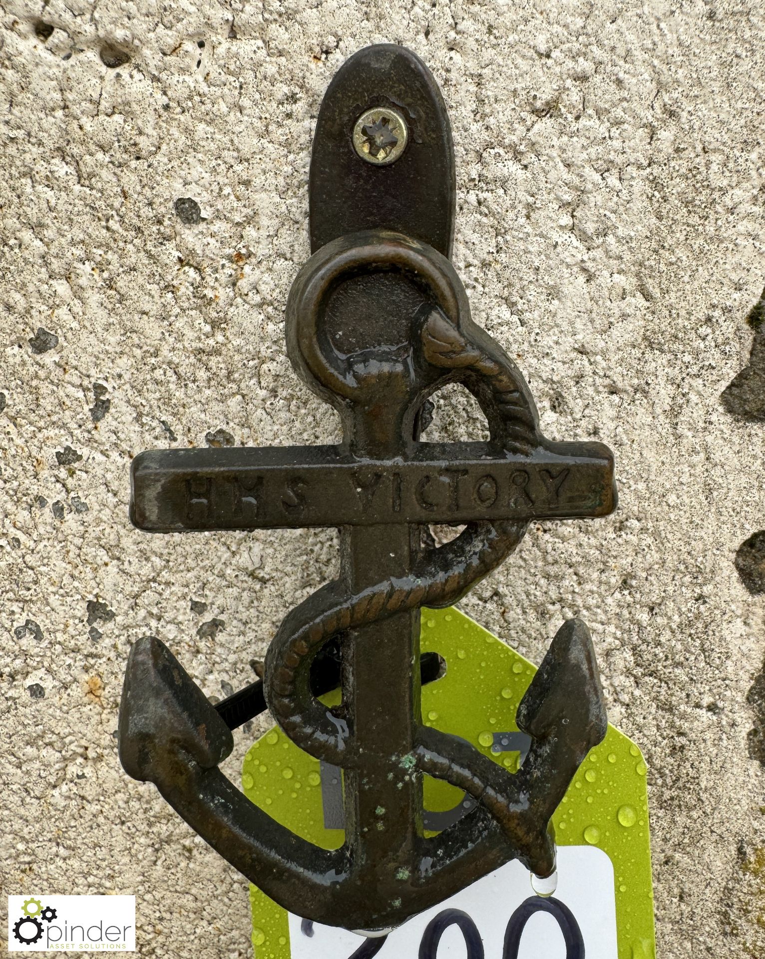 A bronze Door Knocker, shaped as a ships anchor, inscription “H.M.S Victory”, approx. 5in, circa mid