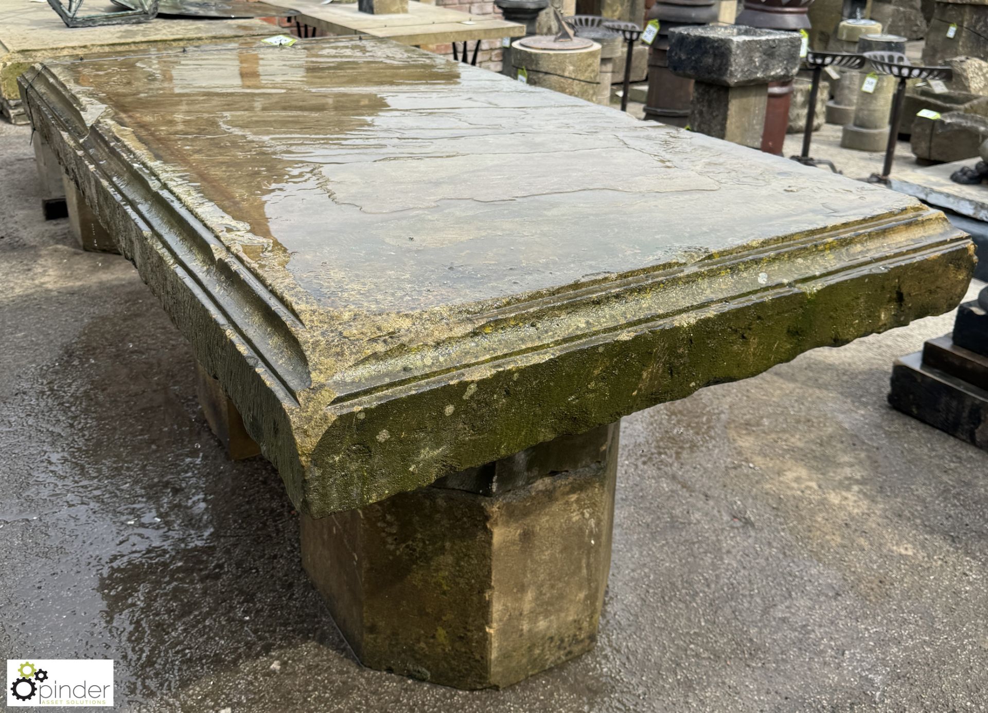 A large Yorkshire stone Table, with decorative moulding sat on 2 half carved octagonal Yorkshire