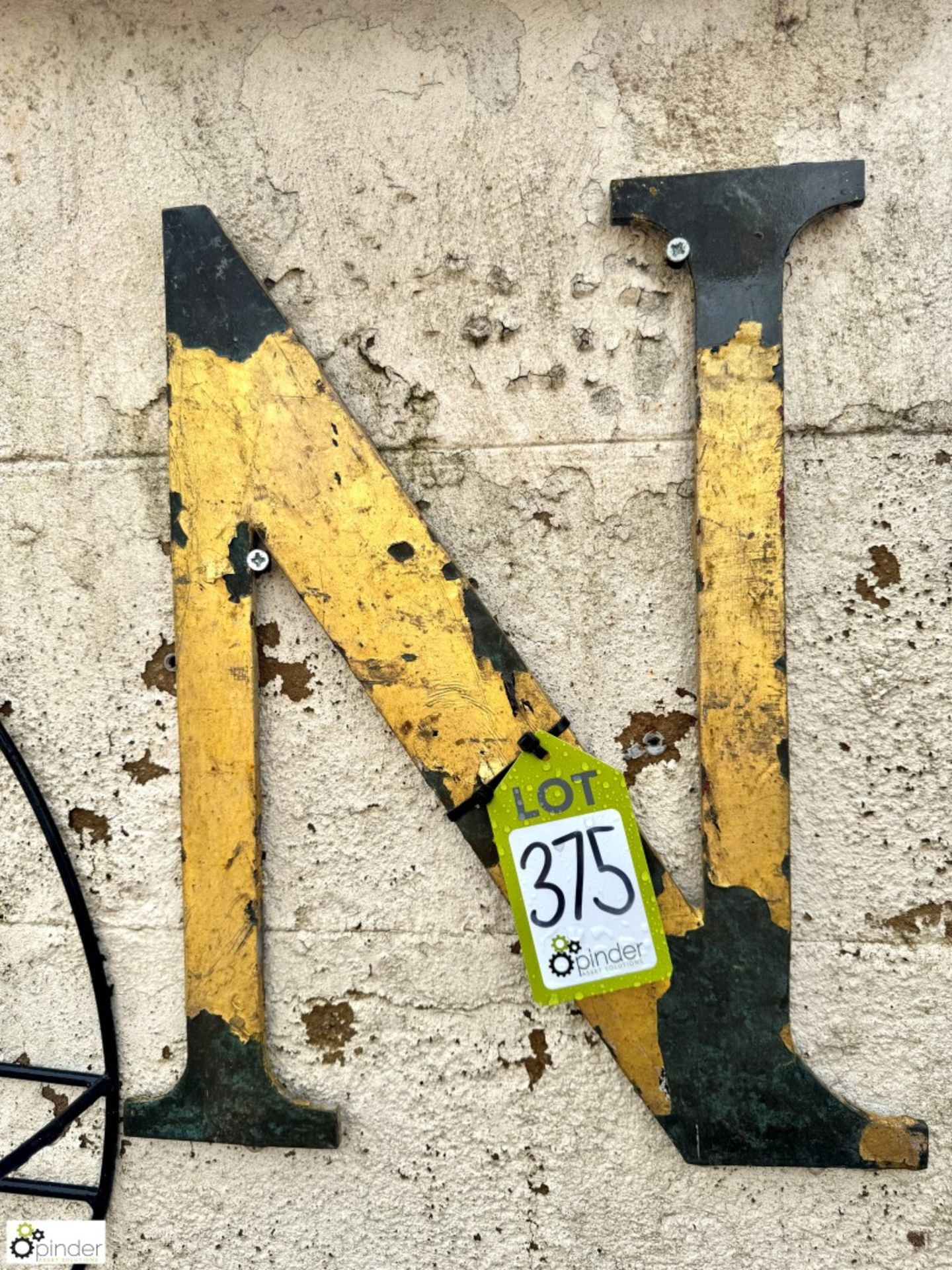 A bronze Letter “N”, with rustic gold leaf paint, approx. 18in x 15in