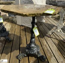 A cast iron Conservatory/Garden Table, with fish balustrade decoration and sandstone hexagonal
