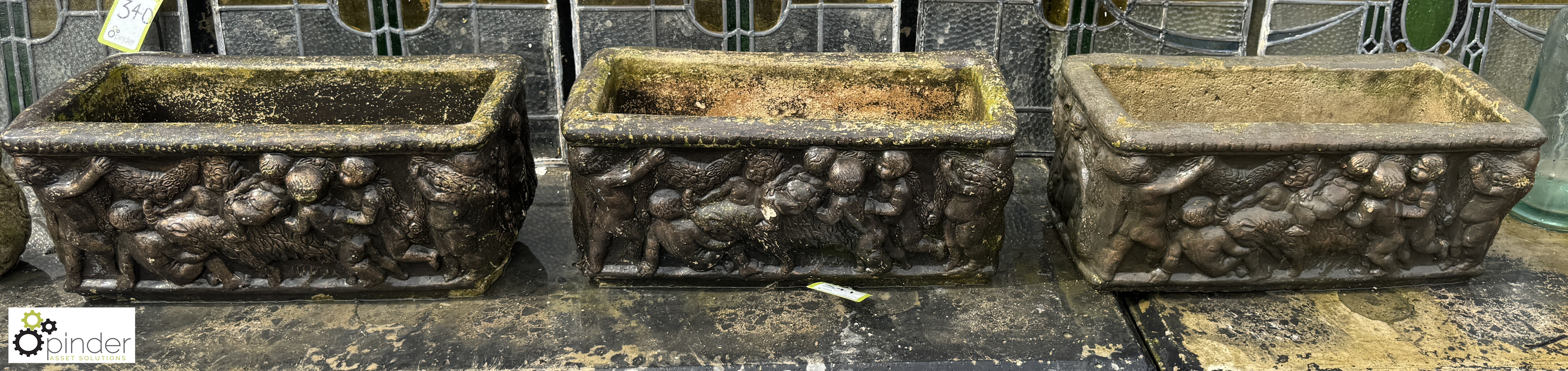 A set 3 reconstituted stone Planters, with classical design depicting 3 cherubs playing, approx. 9in