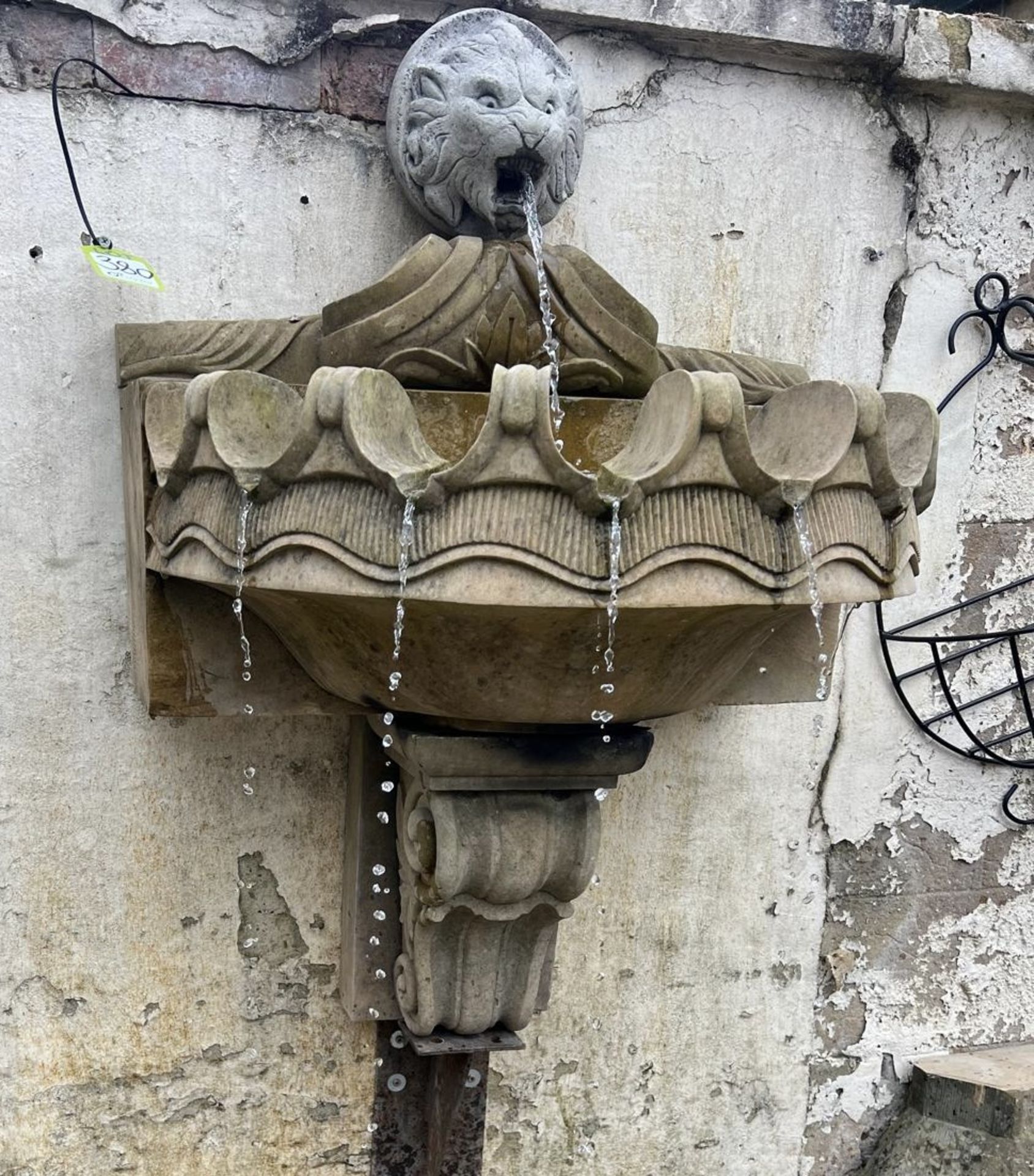 A Wall Fountain comprising reconstituted stone lions head waterspout, mounted above a sandstone clam - Image 6 of 13