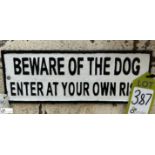 A cast iron Sign “Beware of the dog enter at your own risk”, approx. 5in x 14in