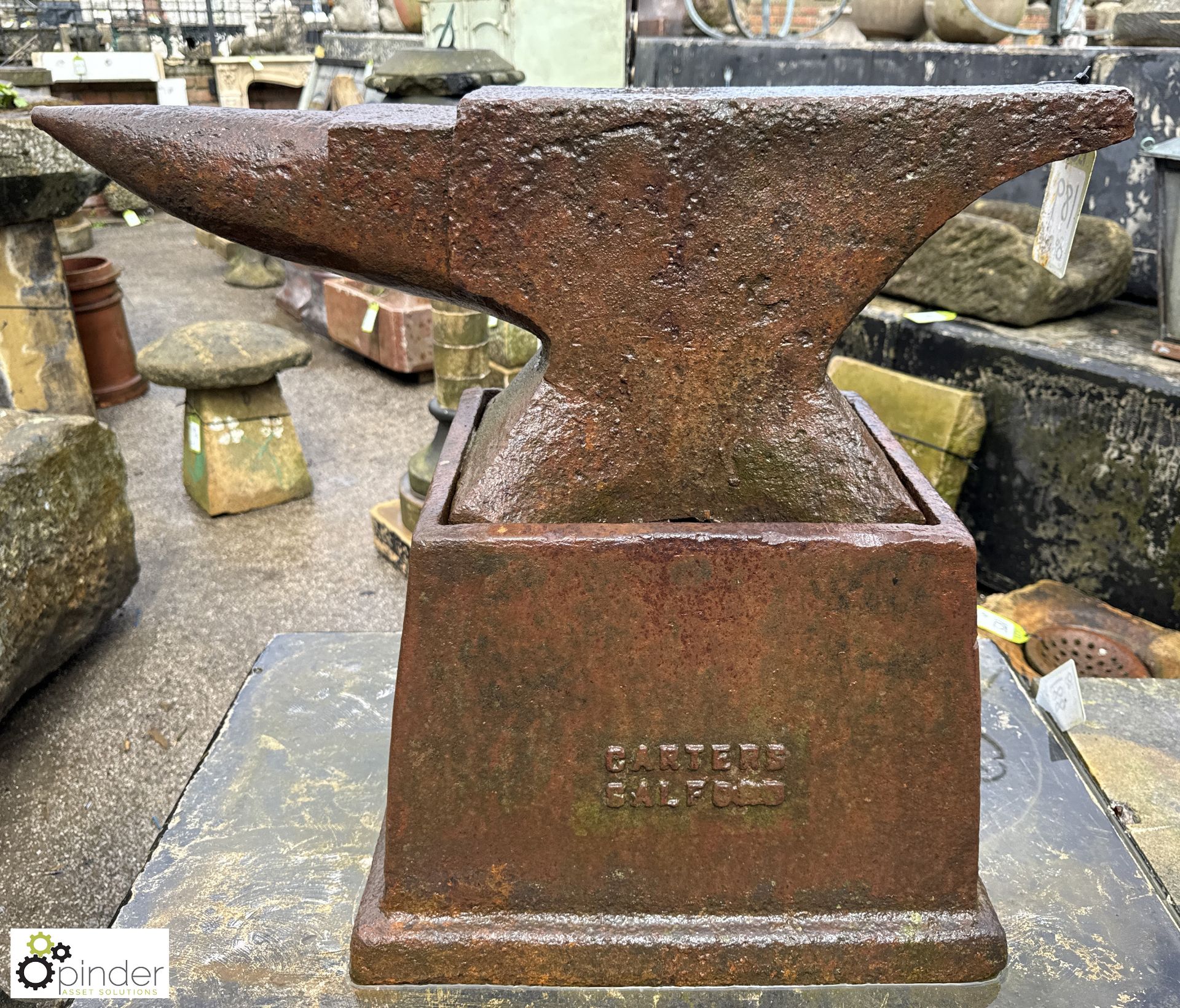 An original Georgian blacksmith Anvil, on an original cast iron base with maker’s mark “Carter’s