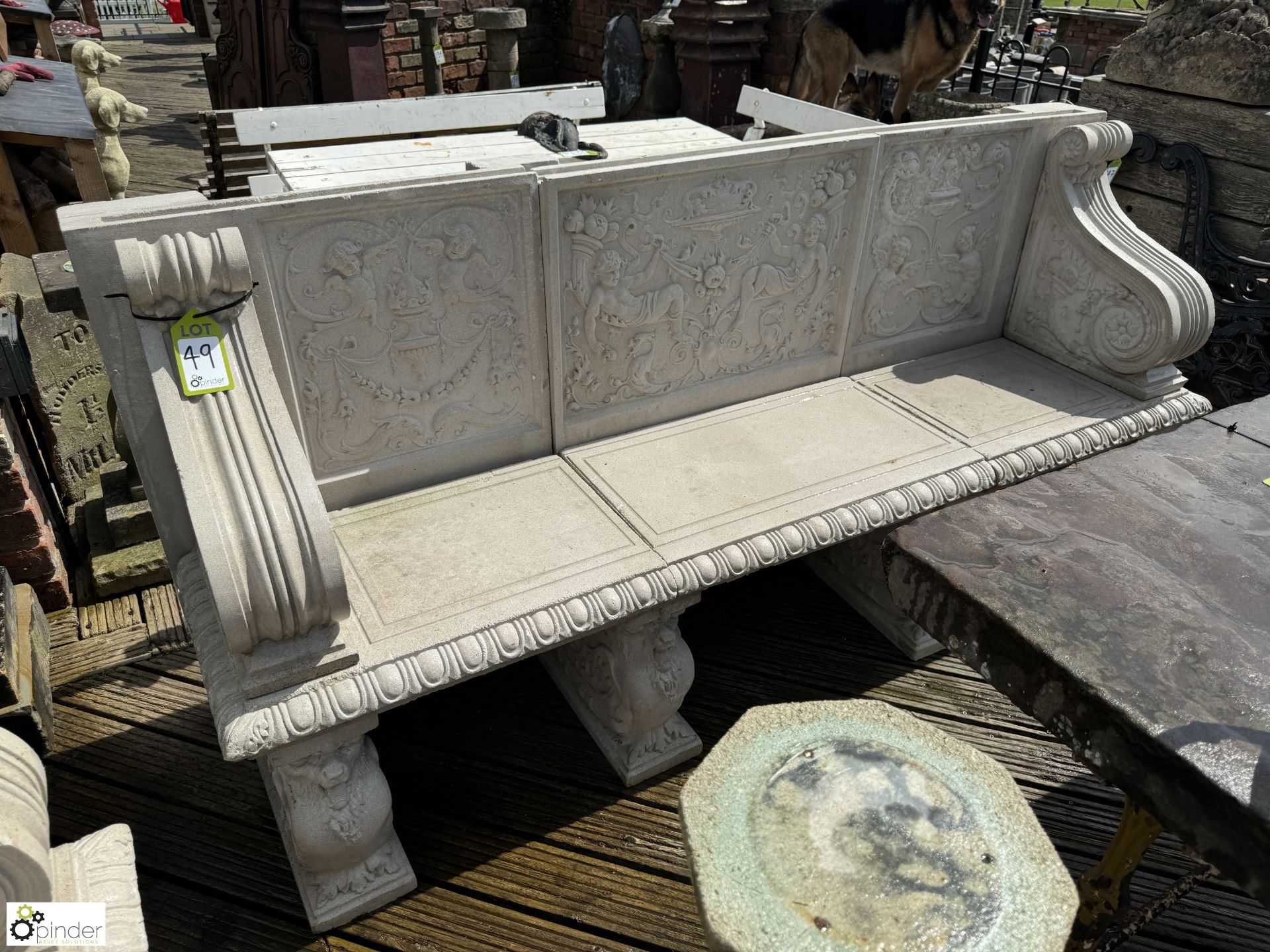 A reconstituted Haddonstone Garden Bench, with classical decoration by Raphael, approx. 40in x 86in
