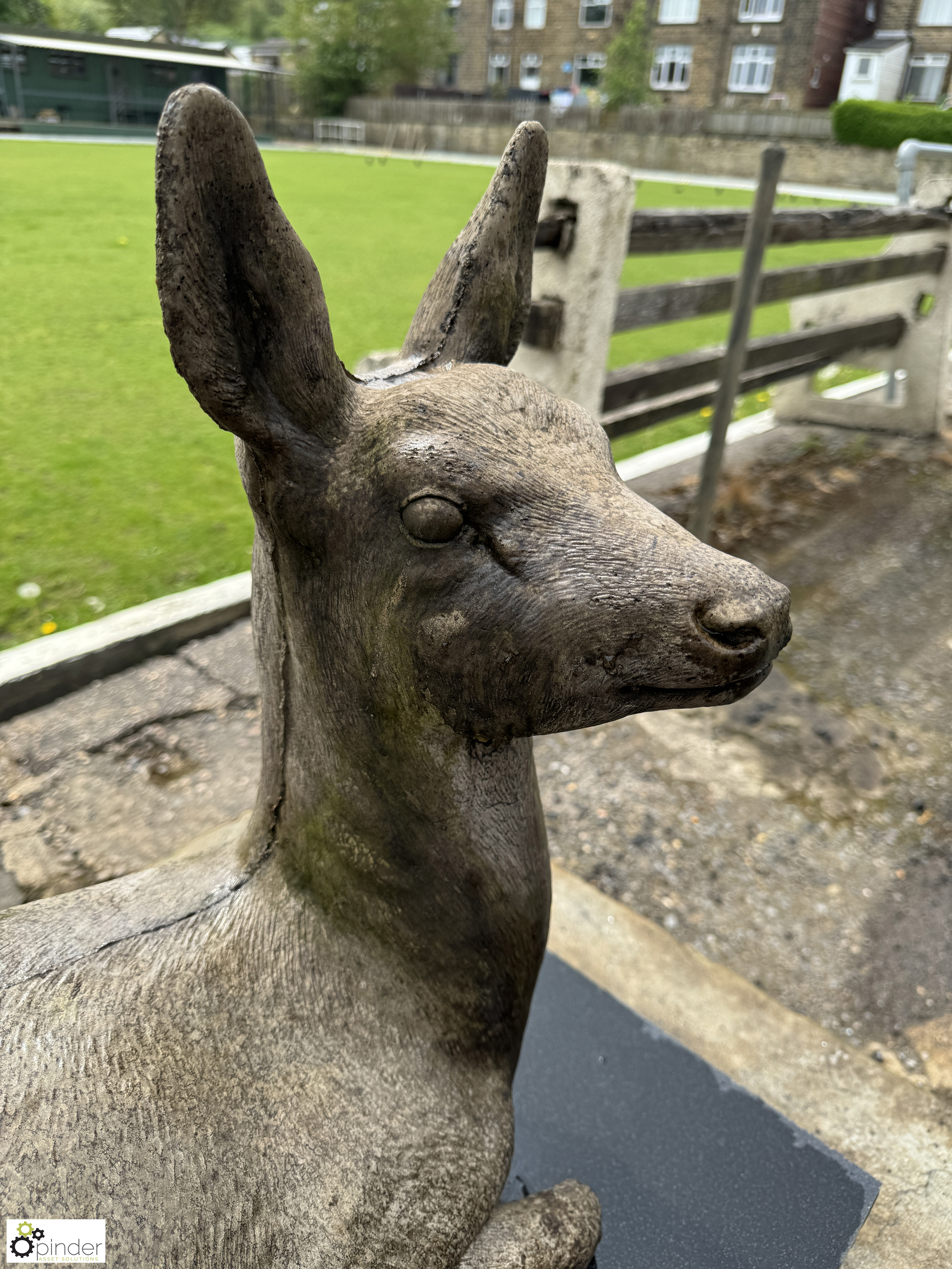 A reconstituted stone seated Deer, on black marble plinth, approx. 20in x 17in x 31in - Image 3 of 8