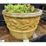 A reconstituted stone Planter, with floral decoration, approx. 12in x 16in diameter