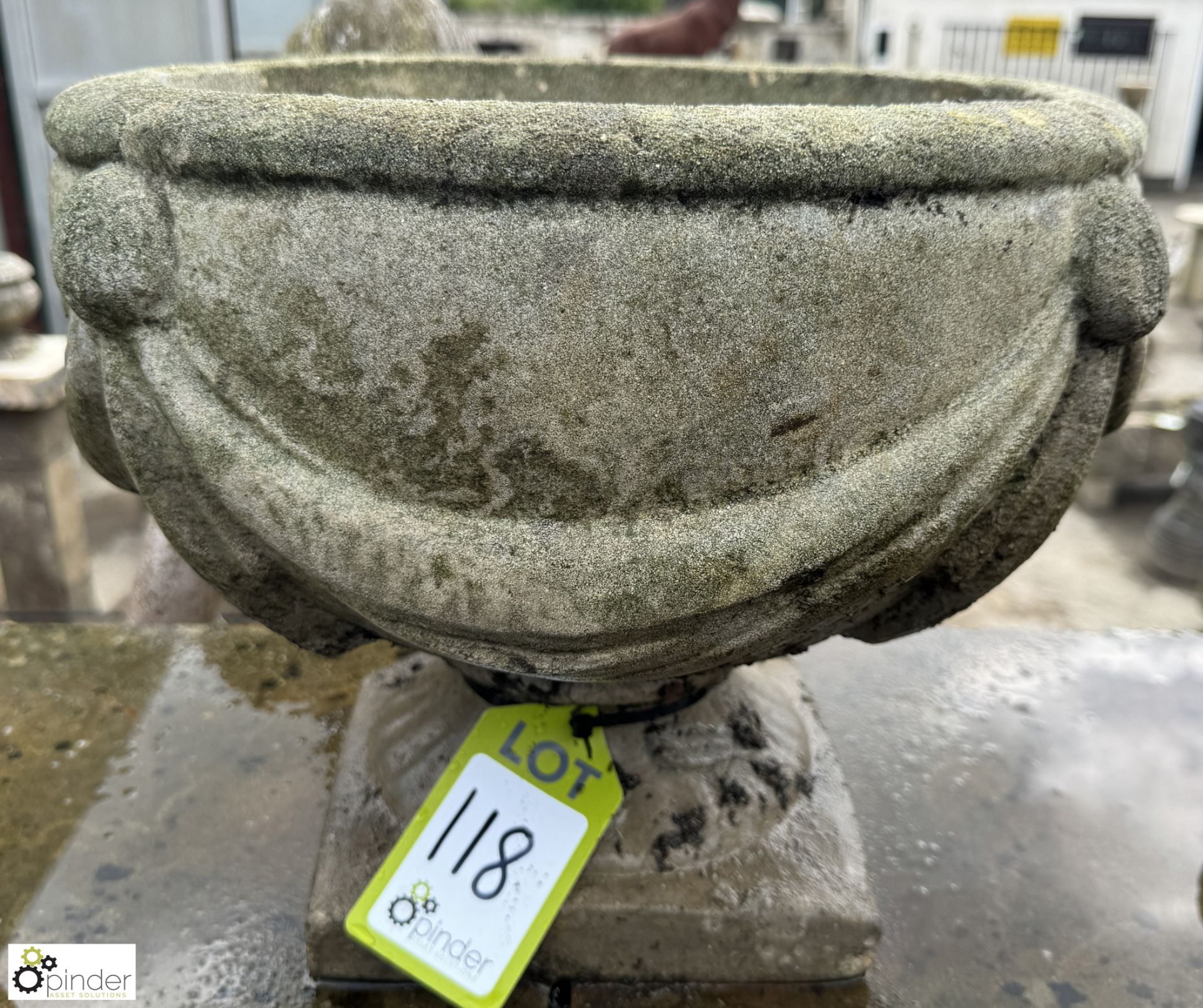 A reconstituted stone Garden Urn, with swag decoration, approx. 14in x 17in diameter