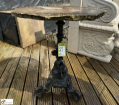 A cast iron Conservatory/Garden Table, with fish balustrade decoration and sandstone hexagonal