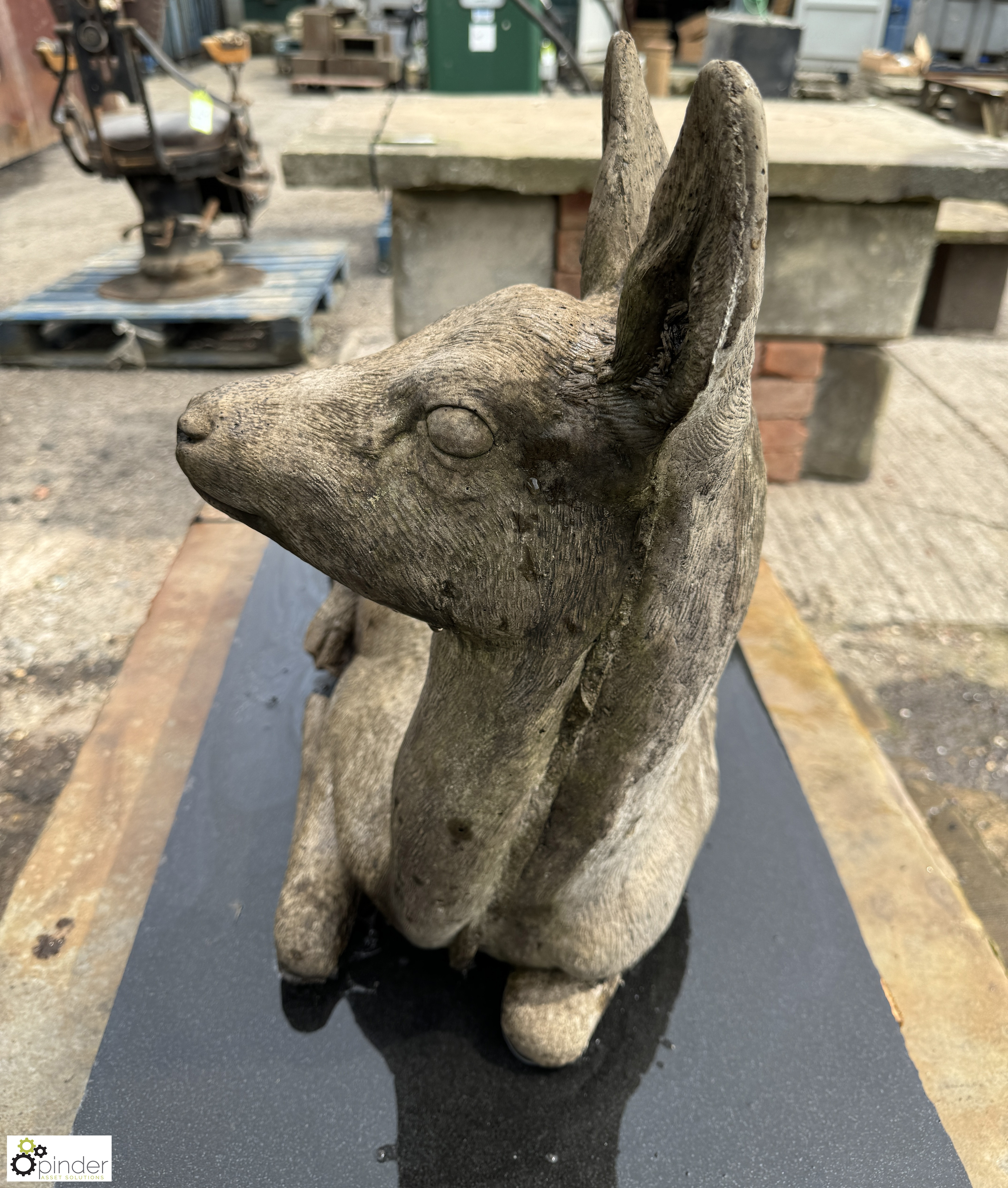 A reconstituted stone seated Deer, on black marble plinth, approx. 20in x 17in x 31in - Image 6 of 8