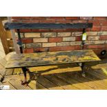 A decorative wrought iron folding Theatre Bench, makers mark “Unity Wood & Iron Company Padiham”,