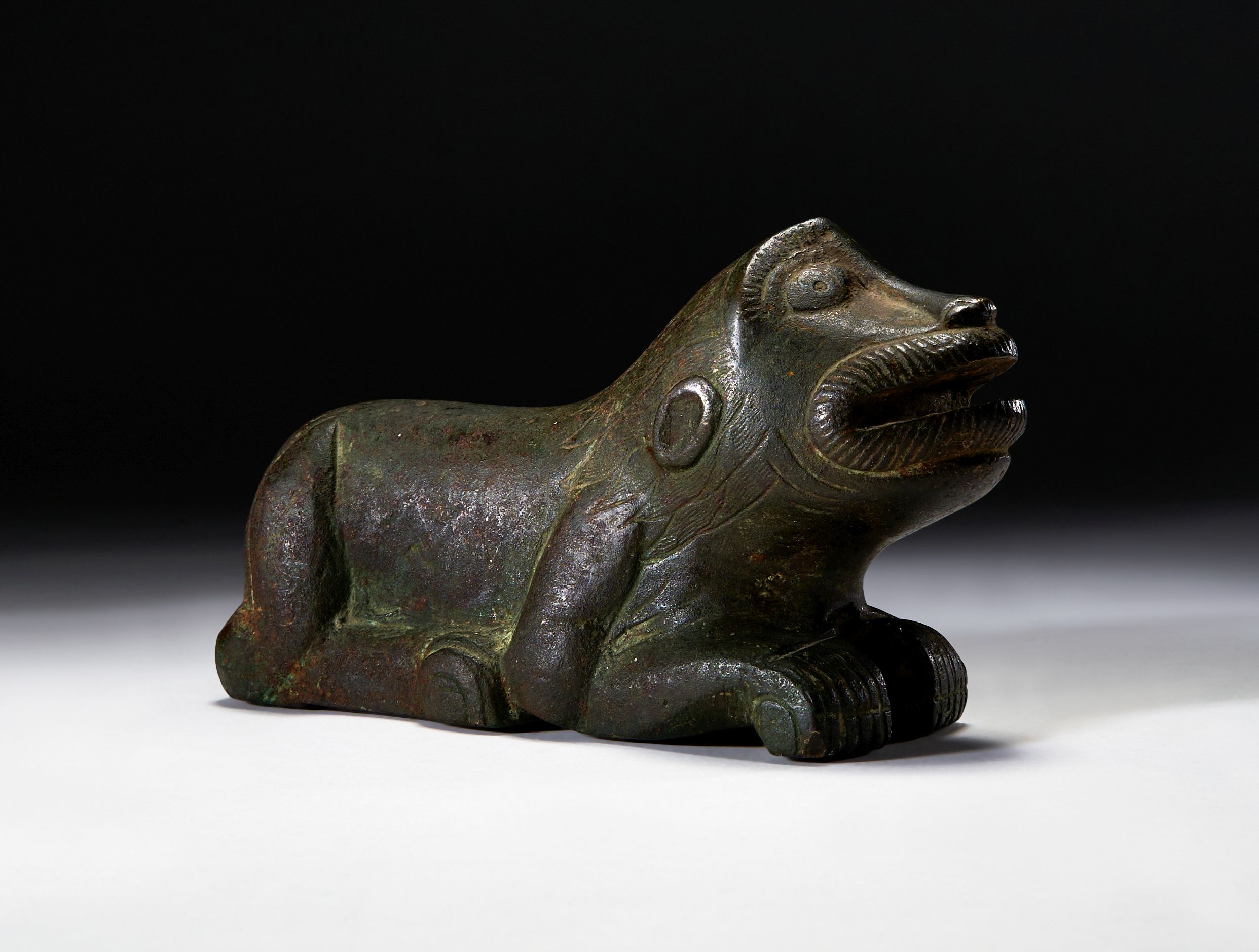 A LARGE BRONZE WEIGHT IN THE FORM OF A FELINE, PROBABLY SICILIAN OR SPANISH