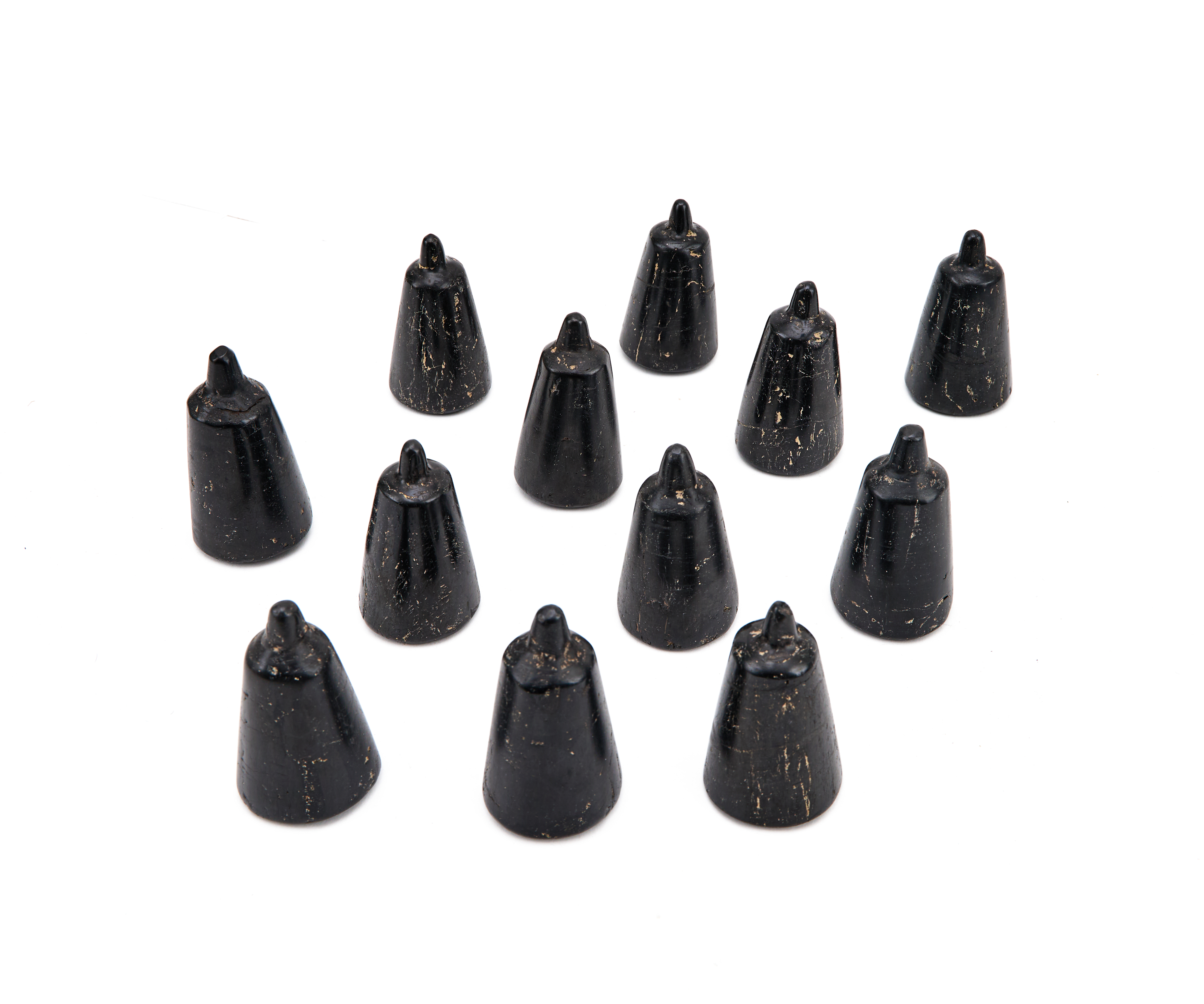 A SET OF TWELVE (12) JET CHESS PIECES, FATIMID, CIRCA 9TH-10TH CENTURY