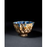 A RARE BLUE SLIP PAINTED KASHAN LUSTRE POTTERY BOWL, CENTRAL IRAN, EARLY 13TH CENTURY