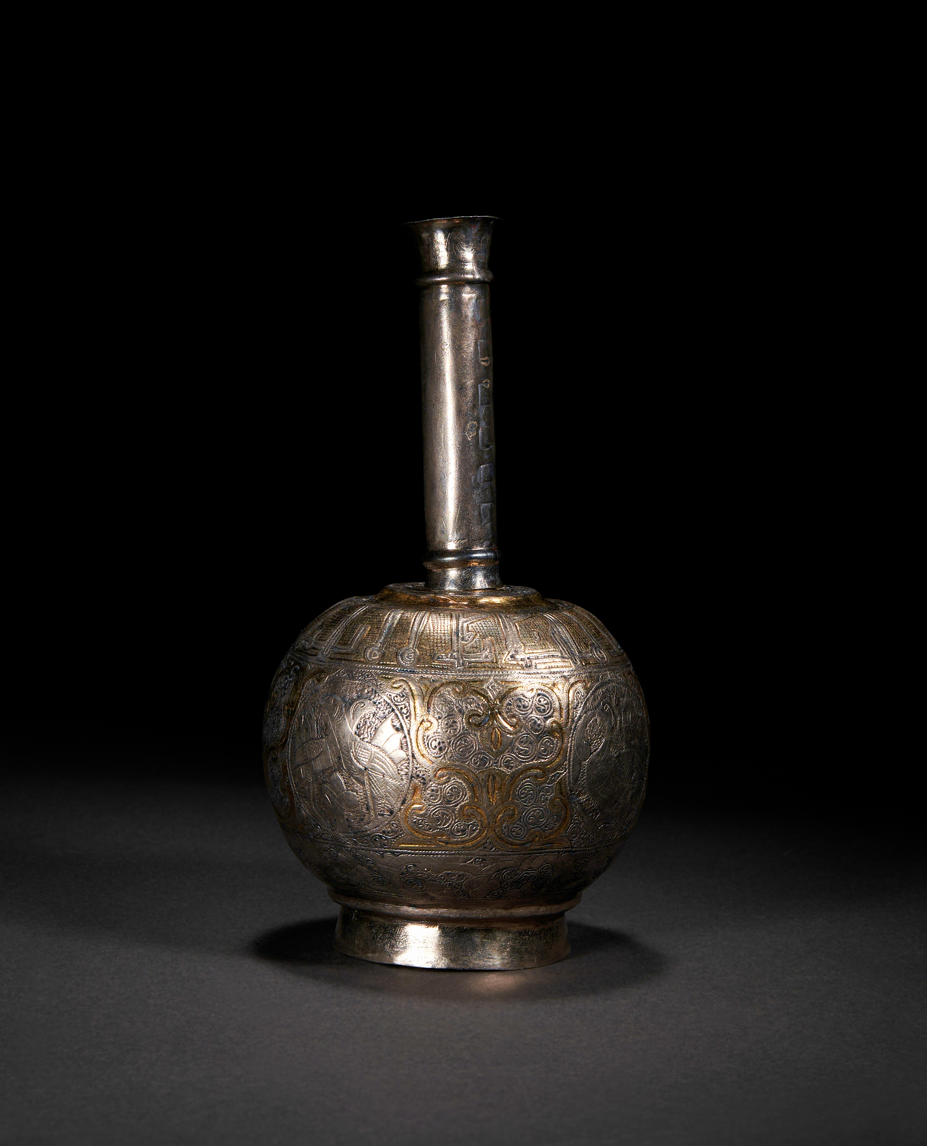 AN EARLY FATIMID KUFIC INSCRIBED PARCEL-GILT SILVER ROSEWATER SPRINKLER, EGYPT, 9TH CENTURY