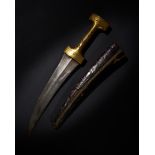 AN OTTOMAN GOLD DAMASCENED HILTED DAGGER (JAMBIYYA), SIGNED AMAL’I UTHMAN, 18TH CENTURY