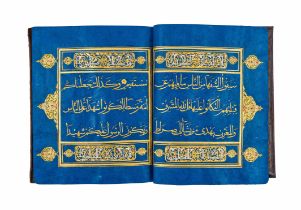 A BLUE QURAN SECTION WITH GOLD CALLIGRAPHY, 19TH/20TH CENTURY