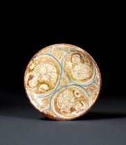 A RARE FIGURAL KASHAN LUSTRE POTTERY DISH CENTRAL IRAN, EARLY 13TH CENTURY