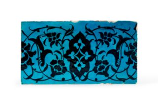 A BLACK AND TURQUOISE 'DOME OF THE ROCK' POTTERY TILE JERUSALEM, OTTOMAN, 16TH CENTURY