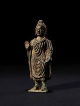 A BRONZE FIGURE OF BUDDHA SHAKYAMUNI