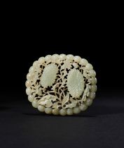 A PALE GREENISH-WHITE JADE RETICULATED FLOWER PLAQUE, YUAN DYNASTY OR LATER