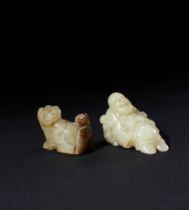 A JADE FIGURE OF A SEATED LUOHAN AND A QILIN, QING DYNASTY (1644-1911)