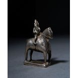 A SILVER FIGURE OF A MAN RIDING A HORSE, 18TH/19TH CENTURY. INDIA