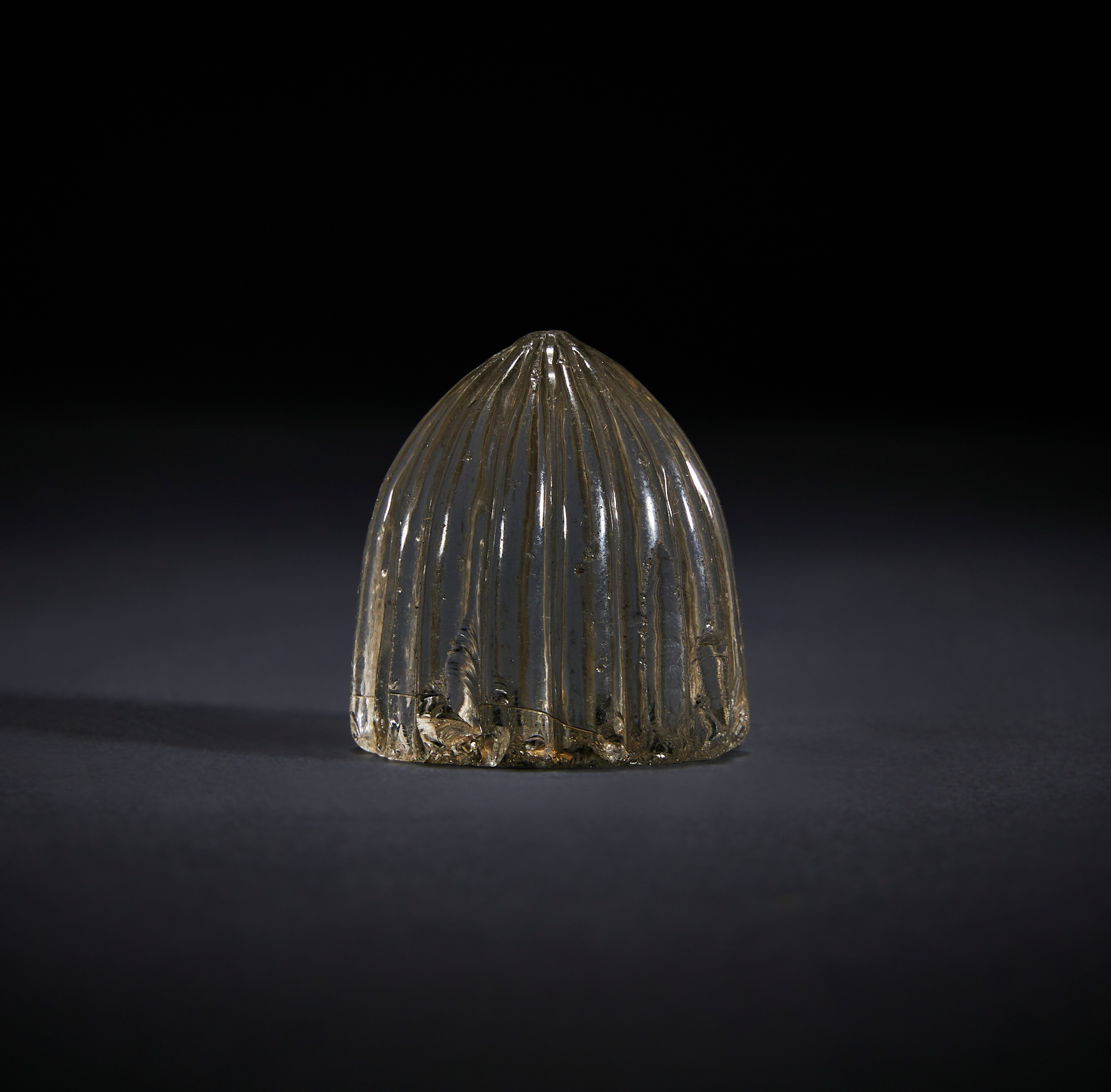 A FATIMID ROCK CRYSTAL GAME PIECE, CIRCA 10TH CENTURY, EGYPT