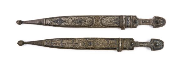 A PAIR OF WHITE METAL DAGGERS, CENTRAL ASIA