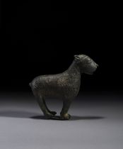 AN ISLAMIC BRONZE AQUAMANILE IN THE FORM OF A FELINE