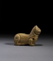 A FATIMID OR MESOPOTAMIAN STONE ANIMAL AMULET, CIRCA 9TH CENTURY