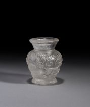 A CARVED ROCK CRYSTAL JAR DEPICTING HUNTING SCENES WITH RAMS AND LIONS,